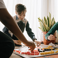 kids playing a game on a table